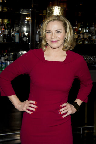 FILE - In this Nov. 3, 2011 file photo, actress Kim Cattrall attends a press event to promote her role in the new Broadway production of Noel Coward's "Private Lives", in New York. Since putting down her last cosmo in the second "Sex and the City" movie where she portrays the man-eater Samantha Jones, Cattrall has politely been trying to shake off Samantha and remind people that she's also a veteran theater actress. (AP Photo/Charles Sykes, file)