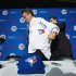 Toronto Blue Jays General Manager Alex Anthopoulos, right, helps new Blue Jays manager John Gibbons, put on his jersey before speaking to he media during a press conference in Toronto on Tuesday, Nov. 20, 2012. (AP Photo/The Canadian Press, Nathan Denette)