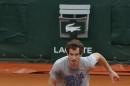Britain's Andy Murray runs for the ball during a training session for the French Open tennis tournament, at the Roland Garros stadium in Paris, Friday, May 23, 2014. The French Open tennis tournament starts Sunday. (AP Photo/Michel Euler)