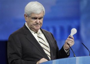 Gingrich holds up a light bulb in remarks about the Republican Party's need to innovate, to the Conservative Political Action Conference (CPAC) in National Harbor