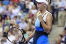 Caroline Wozniacki of Denmark celebrates winning her match against Chanelle Scheepers of South Africa at the U.S. Open tennis championships in New York