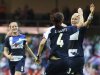 Britain's Stephanie Houghton celebrates her goal with teammates Jill Scott and Sophie Bradley during their women's Group E football match against Cameroon at the London 2012 Olympic Games