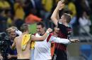 Germany's Bastian Schweinsteiger, left, and Miroslav Klose celebrate after the World Cup semifinal soccer match between Brazil and Germany at the Mineirao Stadium in Belo Horizonte, Brazil, Tuesday, July 8, 2014. Germany won the match 7-1. (AP Photo/Martin Meissner)