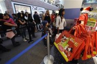 Shoppers line up for Black Friday sales at the Disney store in Glendale, California November 27, 2009. REUTERS/Phil McCarten