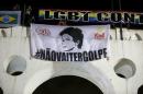 A banner with the image of Brazilian President Dilma Rousseff is displayed during a protest against her impeachment in Rio de Janeiro