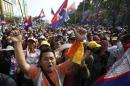 Supporters of the opposition Cambodia National Rescue Party (CNRP) march along a street during a protest in Phnom Penh