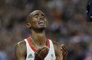 Britain's Mo Farah reacts as he wins gold in the men's 10,000-meter final during the athletics in the Olympic Stadium at the 2012 Summer Olympics, London, Saturday, Aug. 4, 2012. (AP Photo/Anja Niedringhaus)