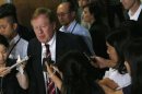 Robert King, U.S. special envoy for North Korean human rights issues, is surrounded by reporters after a meeting in Tokyo