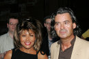FILE - In this July 28, 2005 file picture US singer Tina Turner and her German partner Erwin Bach, right, arrive at a Gala in Basel, Switzerland. Legendary rock singer Tina Turner has married her longtime German beau, Erwin Bach, in a Swiss civil ceremony. The mayor of Kuesnacht, the wealthy Zurich-area community where Turner lives, says that she and Bach, a music executive, were married several weeks ago at the registry office. Markus Ernst told The Associated Press on Thursday, July 18, 2013, it was a routine ceremony, ahead of a private celebration on Sunday July 21, 2013 at the couple's home. (AP Photo/Keystone/Patrick Straub,File)