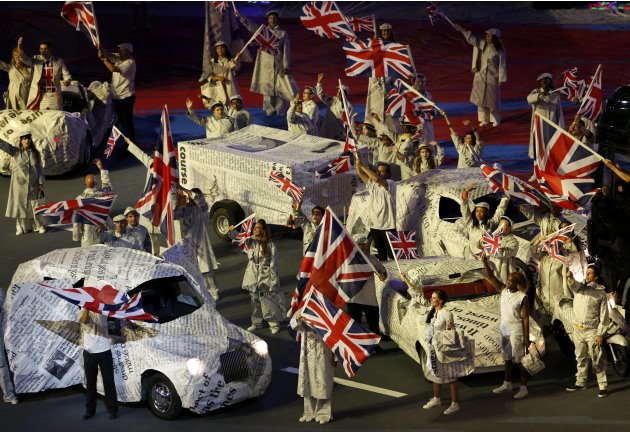 Performers wave Union Jack flags during the closing ceremony of the London 2012 Olympic Games at the Olympic Stadium