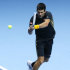 Novak Djokovic of Serbia plays a return to Jo-Wilfried Tsonga of France during their singles tennis match at the ATP World Tour Finals in London Monday, Nov. 5, 2012. (AP Photo/Kirsty Wigglesworth)
