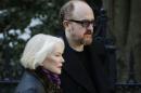 Ellen Burstyn and Louis C.K. arrive for the funeral of actor Philip Seymour Hoffman at the Church of St. Ignatius Loyola, Friday, Feb. 7, 2014 in New York. Hoffman, 46, was found dead Sunday of an apparent heroin overdose. (AP Photo/Mark Lennihan)