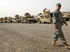 A U.S. army soldier walks past military Humvees which are ready to be shipped out of Iraq at a staging yard at Camp Sather, part of the sprawling U.S. military Victory Base Complex that is set to close in Baghdad, Iraq, Saturday, Oct. 15, 2011. The U.S. has promised to withdraw from Iraq by the end of the year as required by a 2008 security agreement between Washington and Baghdad. Some 41,000 U.S. troops are scheduled to clear out along with their equipment. It's still unclear if the U.S. military will keep several thousand troops in Iraq as leaders weigh whether staunch political opposition in both nations is worth the risk. The uncertainty has been a logistical nightmare for American commanders, who could be asked at the last minute to keep some equipment and manpower back but for now must push ahead in case the withdrawal plan stands. (AP Photo/Khalid Mohammed)