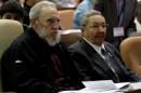 Handout picture released by cubadebate.cu website shows Cuban leader and former president Fidel Castro (L) sitting next to his brother and current president, Raul, in Havana on February 24, 2013