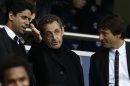Former French President Sarkozy talks with Paris Saint Germain's club owner Al-Khelaifi and sports director Leonardo (R) as they attend the French Ligue 1 soccer match where Paris Saint-Germain faces Brest in Paris
