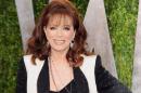 FILE - In this Feb. 24, 2013 file photo, author Jackie Collins arrives at the 2013 Vanity Fair Oscars Viewing and After Party in West Hollywood, Calif. Collins, died in Los Angeles on Saturday, Sept. 19, 2015, of breast cancer. She was 77. (Photo by Evan Agostini/Invision/AP, File)