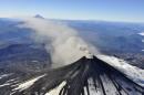 An aerial view shows smoke and ash rising from Villarrica Volcano, south of Santiago