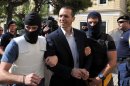 Golden Dawn lawmaker and spokesman Ilias Kasidiaris arrives at the court in Athens on October 1, 2013