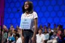 FILE - In this May 30, 2013 file photo, Vanya Shivashankar, 11 of Olathe, Kan., smiles after spelling the word "shillibeer" correctly during the final round of the National Spelling Bee in Oxon Hill, Md. (AP Photo/Evan Vucci)