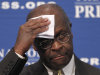 Republican presidential candidate, Herman Cain wipes his forehead before answering questions at the National Press Club in Washington, Monday, Oct., 31, 2011. Denying he sexually harassed anyone, Cain said Monday he was falsely accused in the 1990s while he was head of the National Restaurant Association, and he branded revelation of the allegations a "witch hunt.". (AP Photo/Pablo Martinez Monsivais)