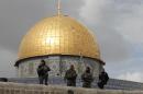 Israeli security forces stand guard near Jerusalem's Dome of the Rock mosque in the Al-Aqsa mosque compound, near where Israeli police recently clashed with protesters, onNovember 5, 2014
