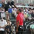 Woods reacts after his final putt on the 18th green during final round play in the 2013 WGC-Cadillac Championship PGA golf tournament in Doral