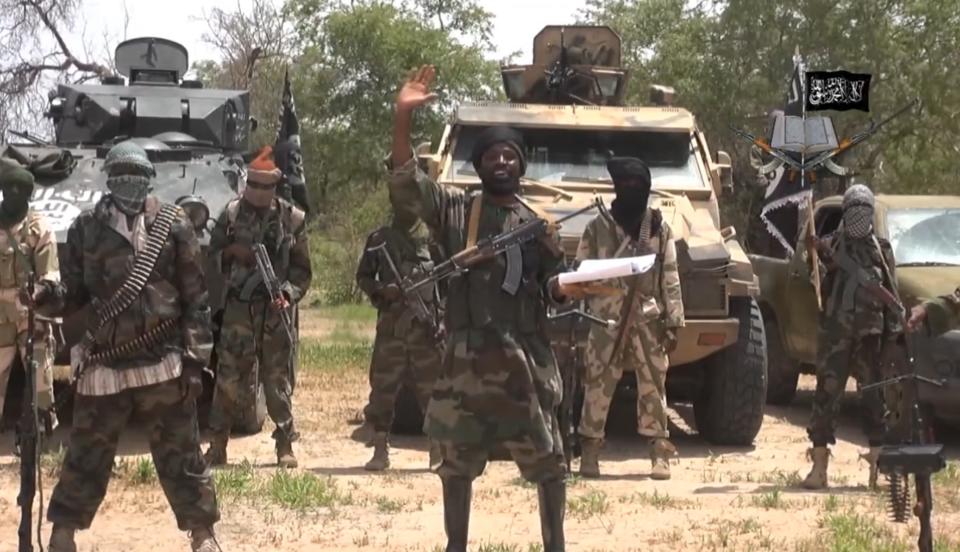 A screengrab taken on July 13, 2014 from a video released by Boko Haram and obtained by AFP shows the leader of the Nigerian Islamist extremist group, Abubakar Shekau (C) (AFP Photo/)