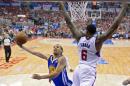 Golden State Warriors guard Stephen Curry, left, puts up a shot as Los Angeles Clippers center DeAndre Jordan defends during the first half in Game 1 of an opening-round NBA basketball playoff series, Saturday, April 19, 2014, in Los Angeles. (AP Photo/Mark J. Terrill)
