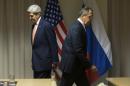 U.S. Secretary of State John Kerry, left, and Russian Foreign Minister Sergey Lavrov walk to their seats for a meeting about Syria, in Zurich, Switzerland, on Wednesday, Jan. 20, 2016, before Kerry was to attend the World Economic Forum in Davos. Kerry’s trip is expected to last nine days and to encompass stops in Switzerland, Saudi Arabia, Laos, Cambodia, and China. (AP Photo/Jacquelyn Martin, Pool)