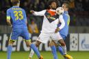 BATE's Denis Polyakov, left, and Ilya Aleksievich, right, vie for the ball against Shakhtar's Luiz Adriano during their Champions League Group Stage in group H soccer match in Borisov, Belarus, Tuesday, Oct. 21, 2014. (AP Photo/Sergei Grits)