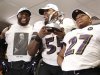 Baltimore Ravens' Suggs, Rice and Lewis celebrate with the AFC Championship Trophy after defeating the New England Patriots in the NFL AFC Championship football game in Foxborough