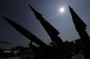 South Korean mock missiles are silhouetted at the Korea War Memorial Museum in Seoul, South Korea, Sunday, Oct. 7, 2012. South Korea said the U.S. has agreed to allow it to develop longer-range missiles that could strike all of North Korea. (AP Photo/Lee Jin-man)