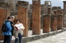 People visit the ruins at the ancient archaeological site of Pompeii