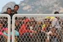 Migrants wait to disembark from the military ship "Bettica" following a rescue operation at sea on May 5, 2015 in the port of Salerno, southern Italy