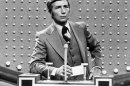 FILE - This June 1978 file photo shows Richard Dawson, host of "Family Feud" in character. Dawson, the wisecracking British entertainer who was among the schemers in the 1960s sitcom "Hogan's Heroes" and a decade later began kissing thousands of female contestants as host of the game show "Family Feud" died Saturday, June 2, 2012. He was 79. (AP Photo, File)