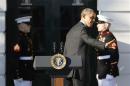 Obama departs after remarks welcoming NCAA champion athletes to the South Lawn of the White House in Washington