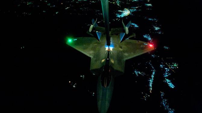 This US Air Forces Central Command photo shows an  F-22A Raptor refueling in the US Central Command area of responsibility prior to strike operations in Syria on September 26, 2014