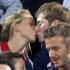 Gold medal-winning British cyclists Laura Trott and Jason Kenny kiss during the women's beach volleyball final during the London 2012 Olympic Games