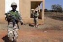 Nigerian soldiers patrol at the Mali air force base near Bamako