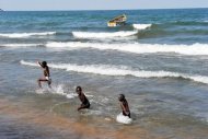 Children play on Saga Beach at Lake Malawi. Malawian President Joyce Banda said Wednesday her country will not "go to war" with Tanzania over a border dispute in Lake Malawi, now poised to become a new oil and gas frontier. (AFP Photo/ALEXANDER JOE)