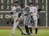 New York Yankees' Dickerson celebrates with Granderson and Suzuki at the end of the ninth inning of American League MLB baseball action against the Boston Red Sox at Fenway Park in Boston