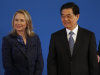 U.S. Secretary of State Hillary Rodham Clinton, left, stands with Chinese President Hu Jintao during the opening ceremony of the U.S.- China Strategic and Economic Dialogue at the Diaoyutai state guesthouse in Beijing Thursday, May 3, 2012. (AP Photo/Vincent Thian)