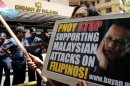 Protesters rally in front of the Malaysian embassy in Manila on March 13, 2013