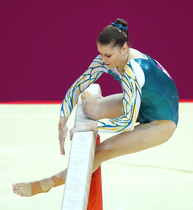 Georgia Bonora of Australia slips as she competes on the balance beam during the women's gymnastics qualification in London