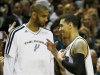 Spurs' Green is congratulated by teammate Duncan as he comes out of the game against the Heat during Game 3 of their NBA Finals basketball playoff in San Antonio