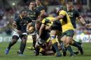 Vermeulen of South Africa's Springboks is tackled by Carter and Cowan of Australia's Wallabies during their Tri-Nations Rugby Union match at Subiaco Oval in Perth
