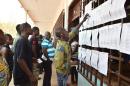 People queue at a polling station in Bangui to vote in the Central African Republic second round of the presidential and legislative elections on February 14, 2016