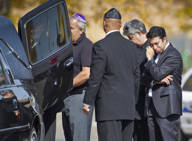 A pallbearer cries after carrying the casket of Reuven Rahamim to the hearse at Beth El Synagogue in St. Louis Park, Minn., on Sunday, Sept. 30, 2012. Rahamim was killed in a workplace shooting Thursday. Andrew Engeldinger, 36, walked into the Minneapolis business on Thursday afternoon and fatally shot five people. (AP Photo/Star Tribune, Renee Jones Schneider)