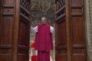 In this image taken from video provided by CTV, Monsignor Guido Marini, master of liturgical ceremonies, closes the double doors to the Sistine Chapel in Vatican City Tuesday, March 12, 2013, at the start of the conclave of cardinals to elect the next pope. Marini closed the doors after shouting "Extra omnes," Latin for "all out," telling everyone but those taking part in the conclave to leave the frescoed hall. He then locked it. (AP Photo/CTV)