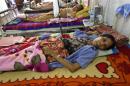 Women lie in a ward as they get treatment in Muslims Charity hospital in Yangon